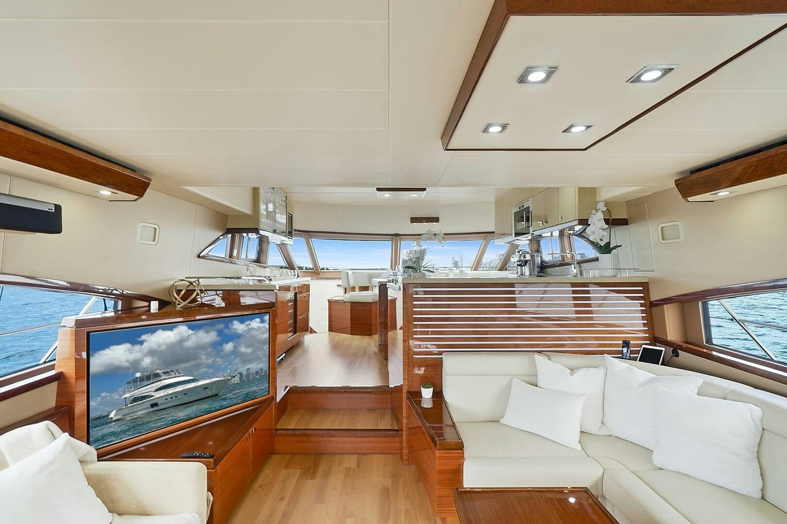 a living room with a large television aboard DREAM Yacht for Sale
