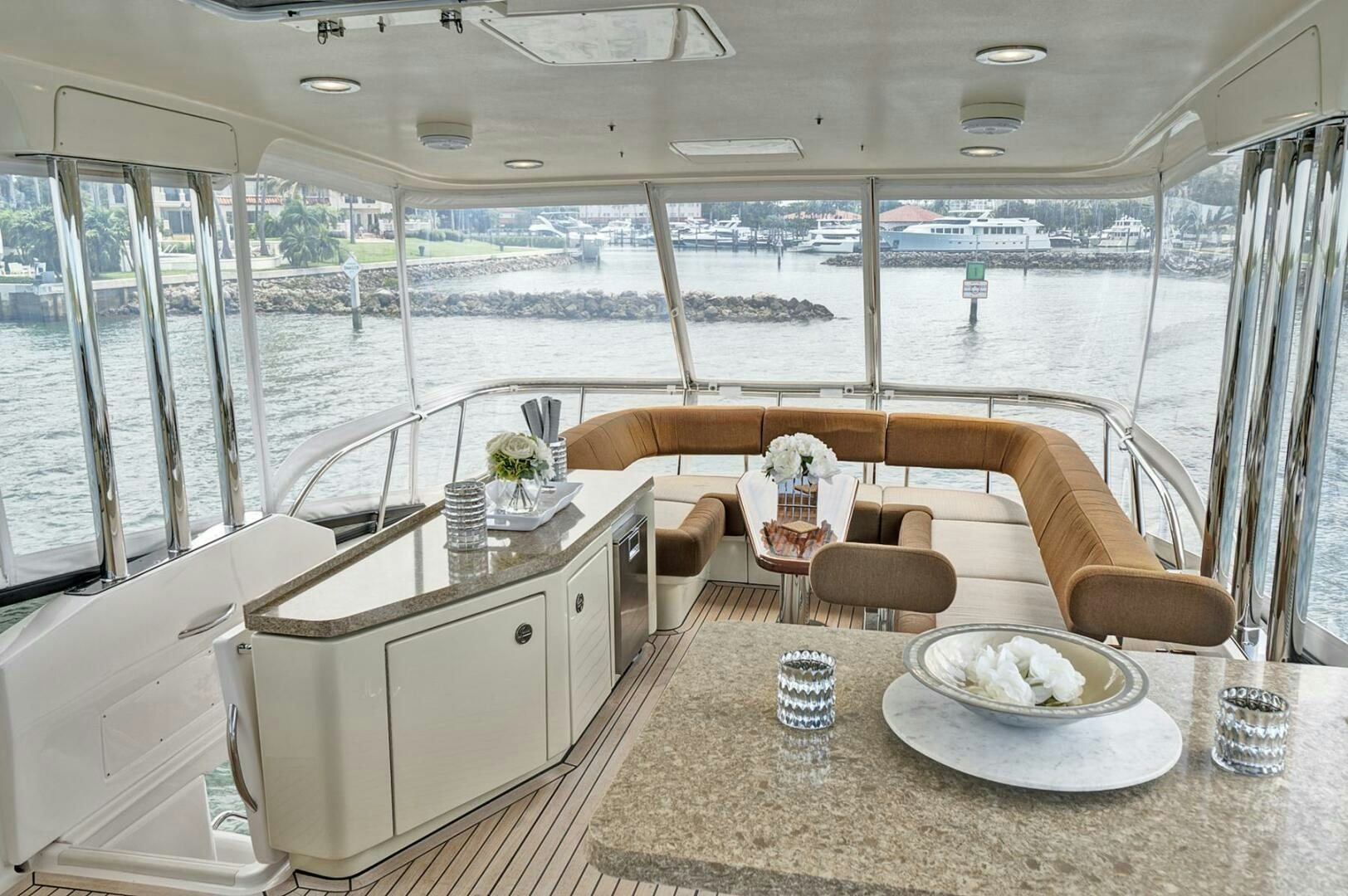 a room with a table and chairs aboard DREAM Yacht for Sale