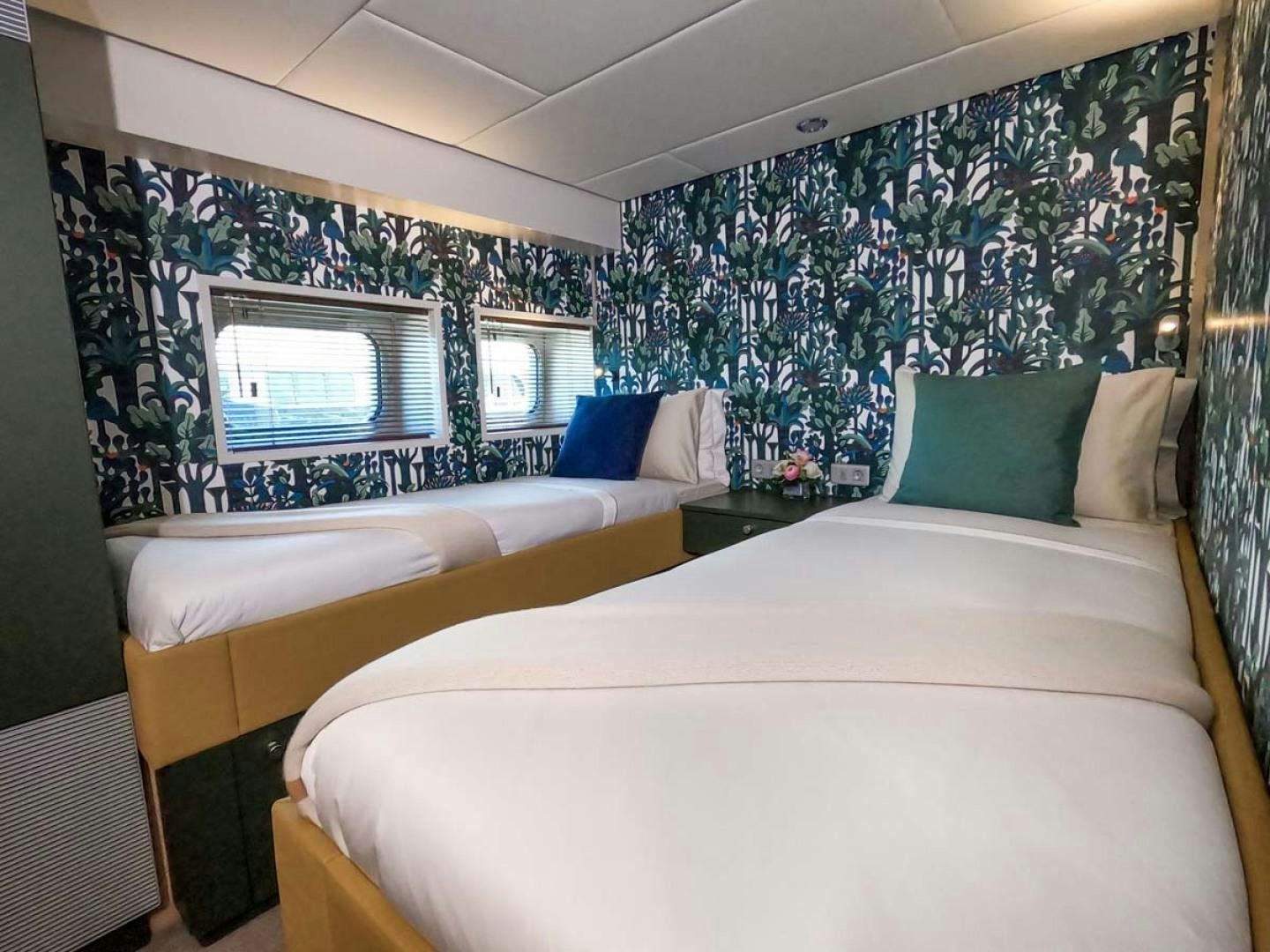 a couple of beds in a room aboard BAD COMPANY SUPPORT Yacht for Sale