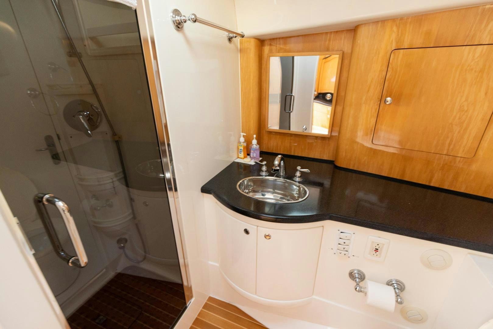 a bathroom with a sink and a shower aboard Forget about it. Yacht for Sale