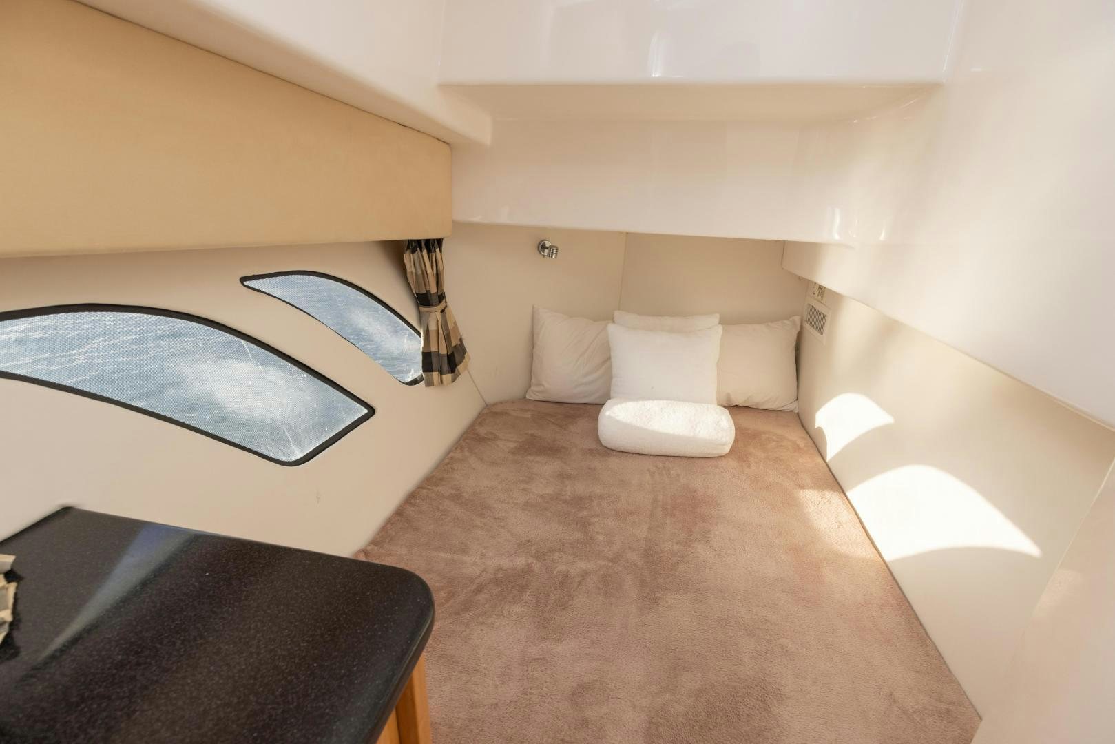 a room with a bed and a rug aboard Forget about it. Yacht for Sale