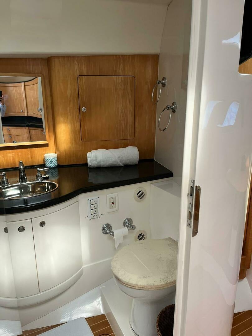 a bathroom with a sink and toilet aboard Forget about it. Yacht for Sale