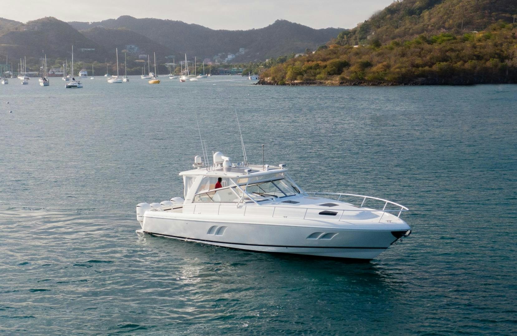 a white boat in the water aboard Forget about it. Yacht for Sale
