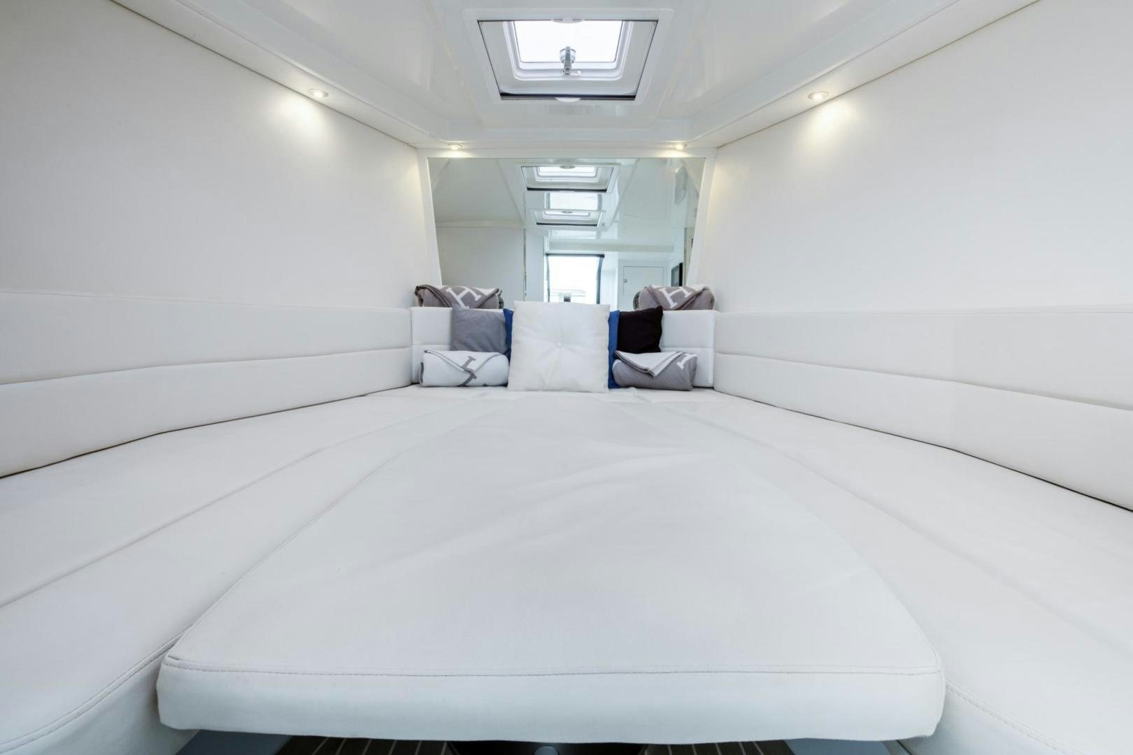 a bed with white sheets aboard SVG II Yacht for Sale