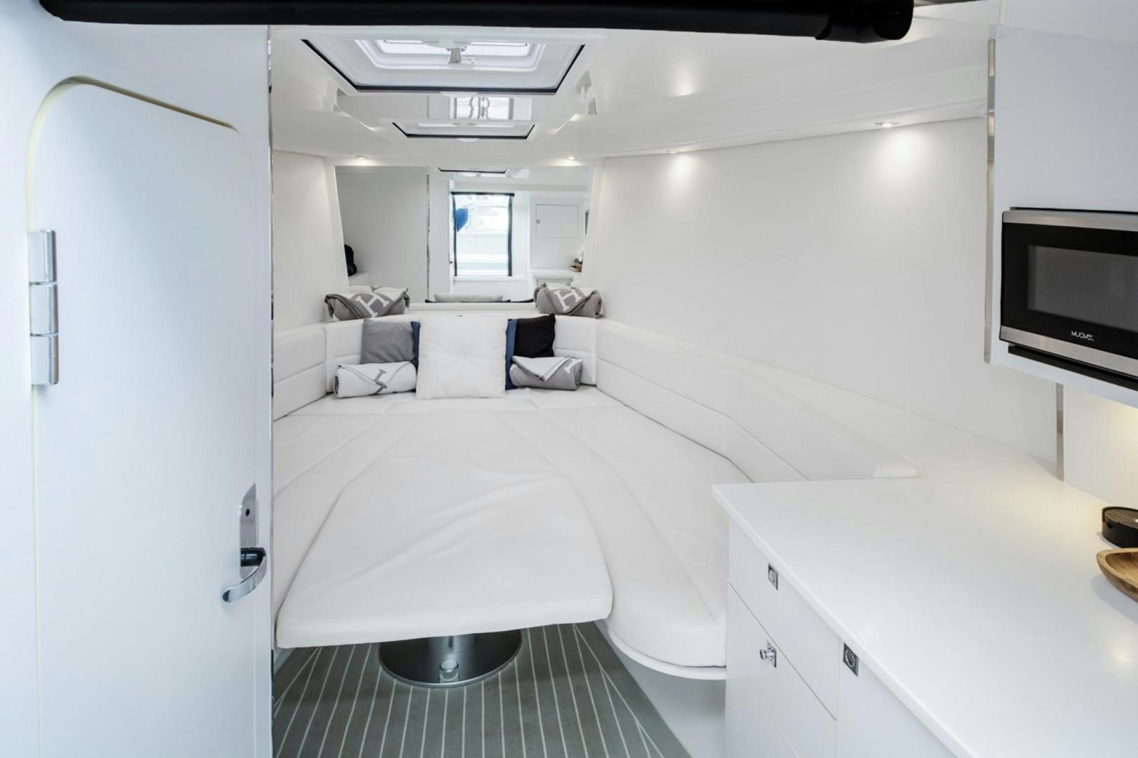 a room with a bed and a desk aboard SVG II Yacht for Sale
