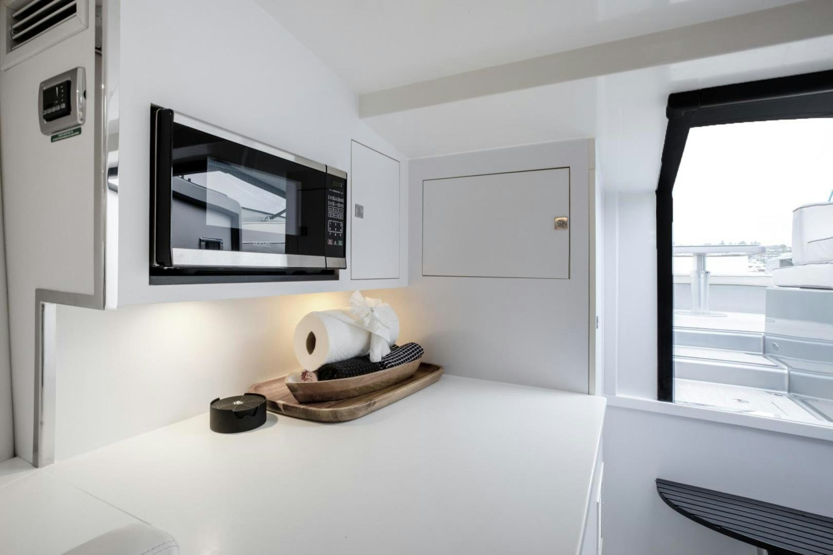 a microwave oven on a counter aboard SVG II Yacht for Sale