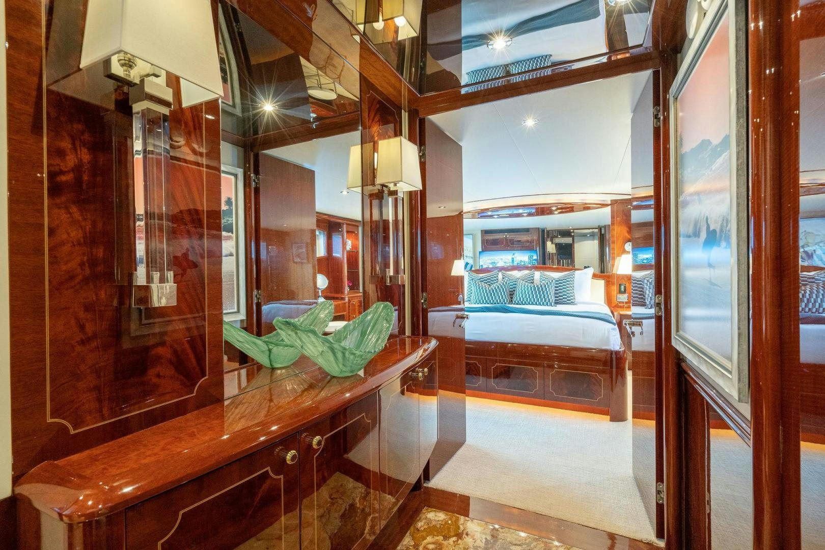 a room with a bed and a desk aboard NAMASTAY Yacht for Sale