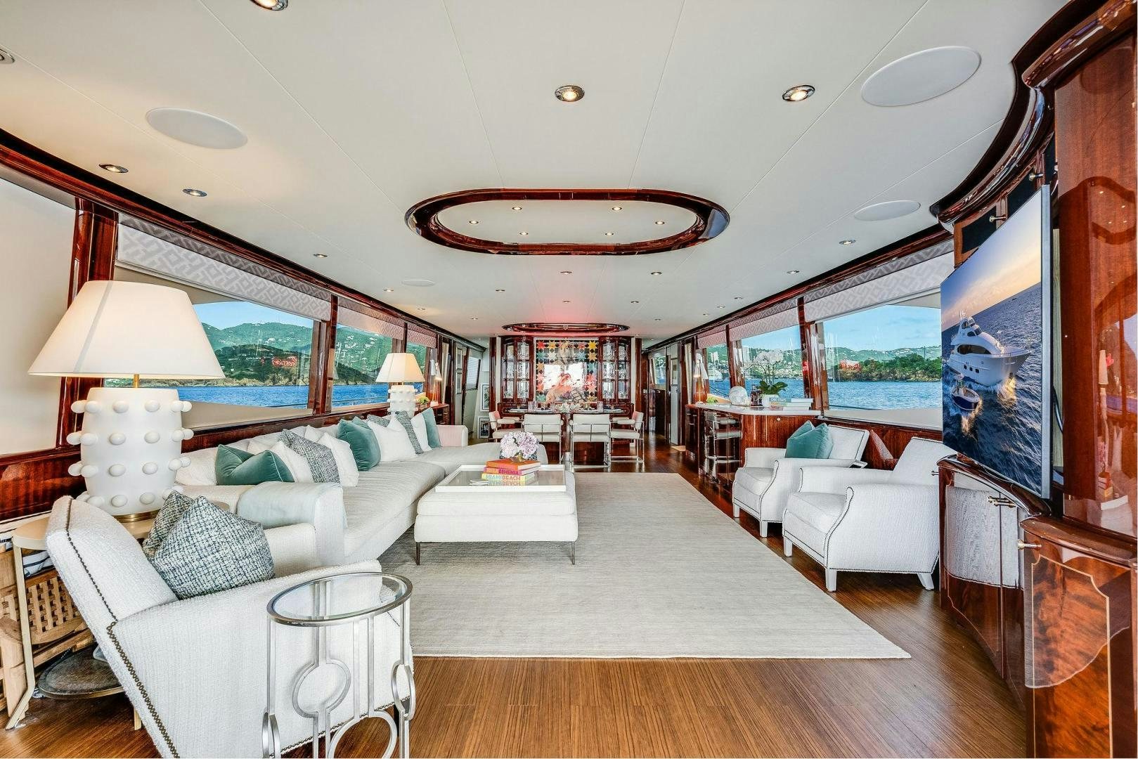 a large living room with a large window aboard NAMASTAY Yacht for Sale