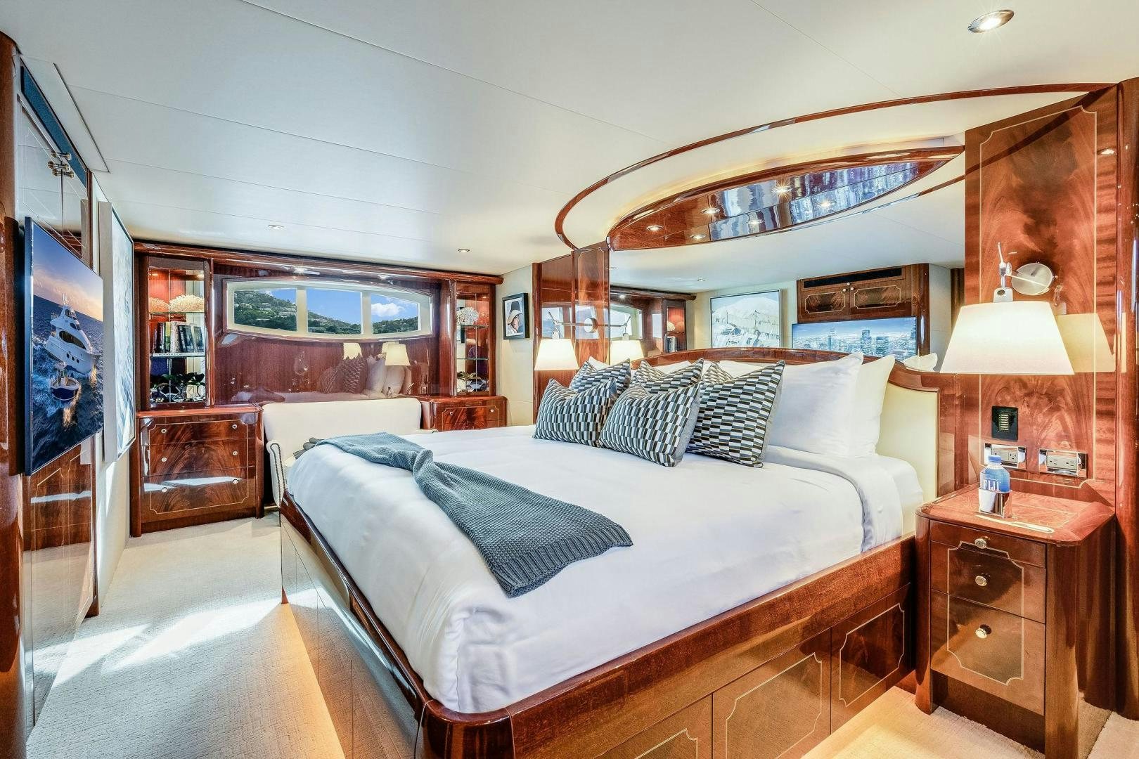 a bedroom with a large bed aboard NAMASTAY Yacht for Sale