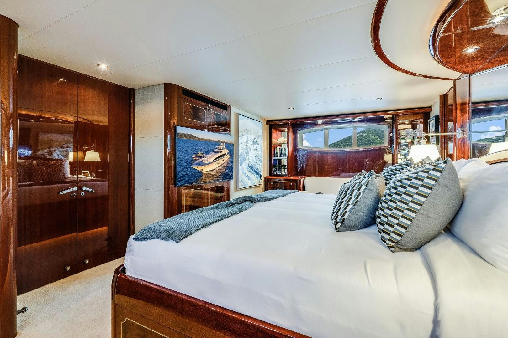 a bedroom with a large bed aboard NAMASTAY Yacht for Sale