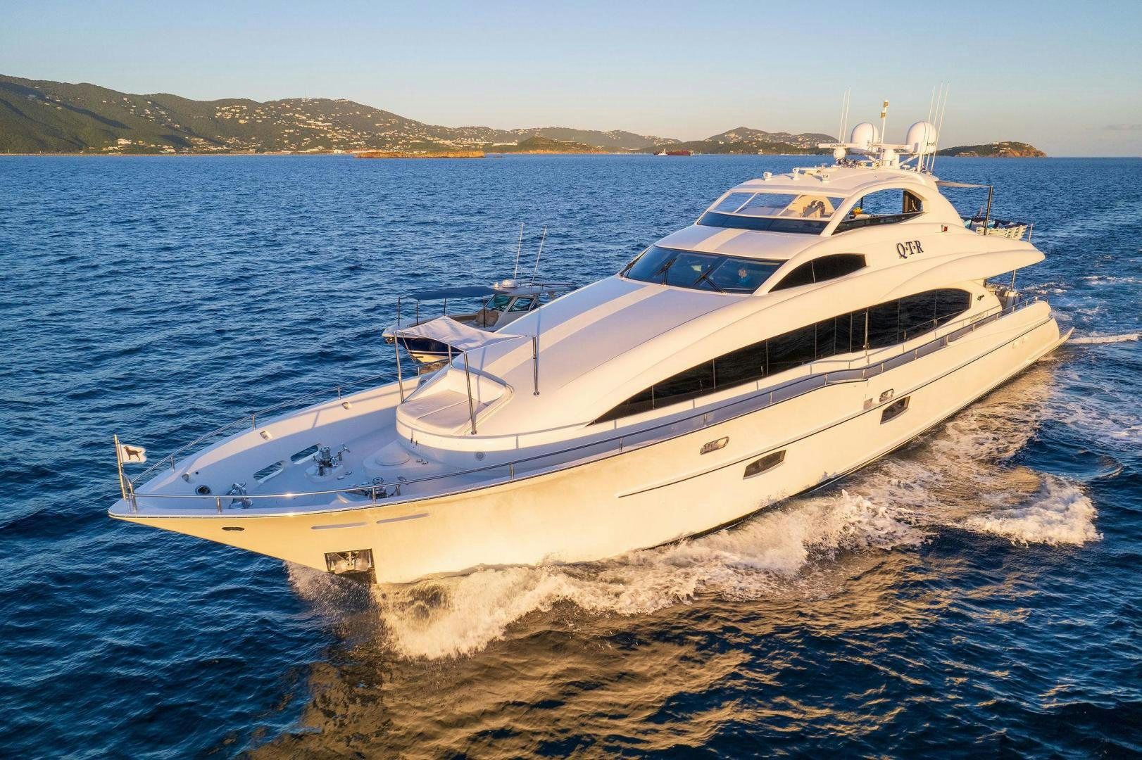 a white yacht on the water aboard NAMASTAY Yacht for Sale