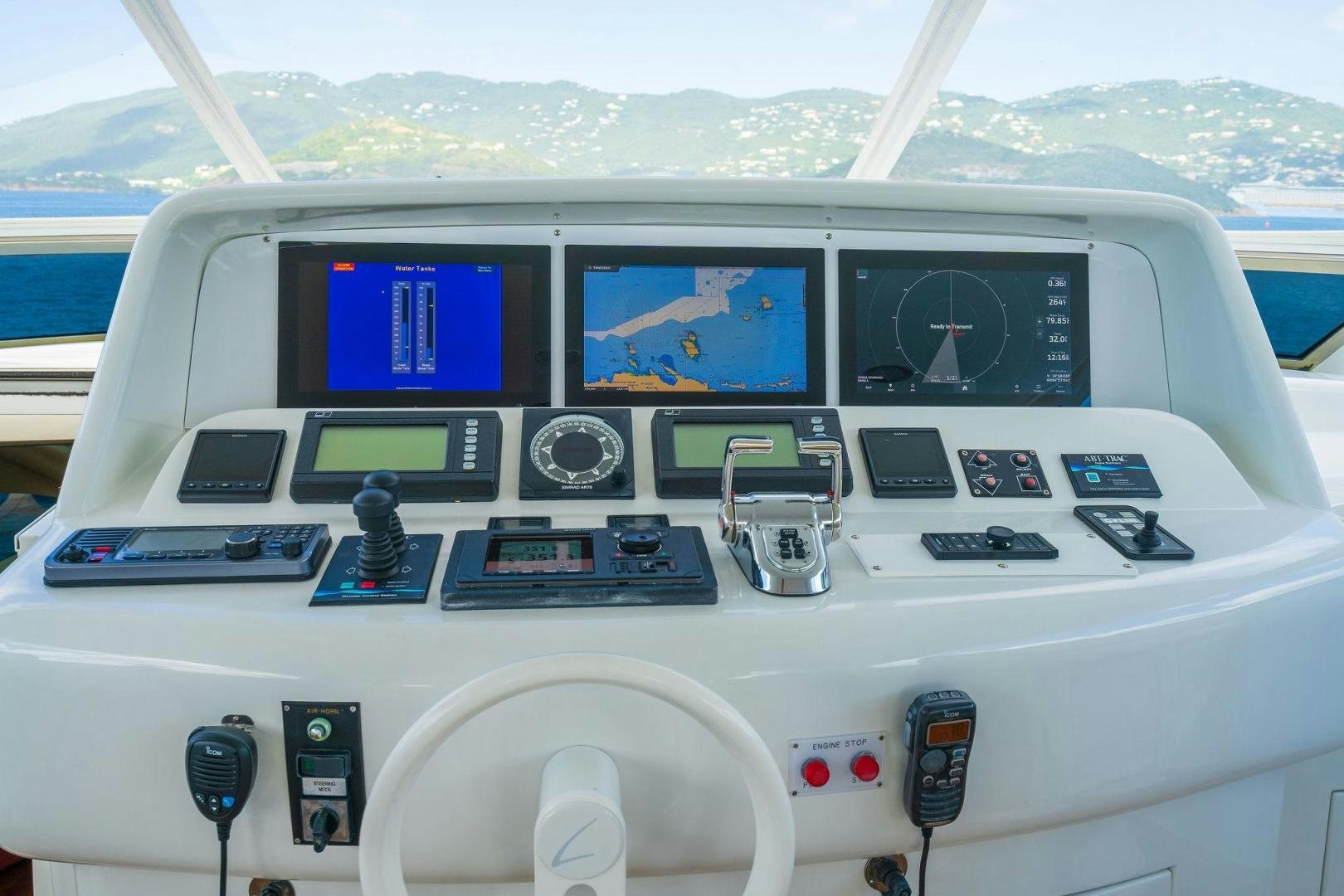a white boat with many buttons and screens aboard NAMASTAY Yacht for Sale