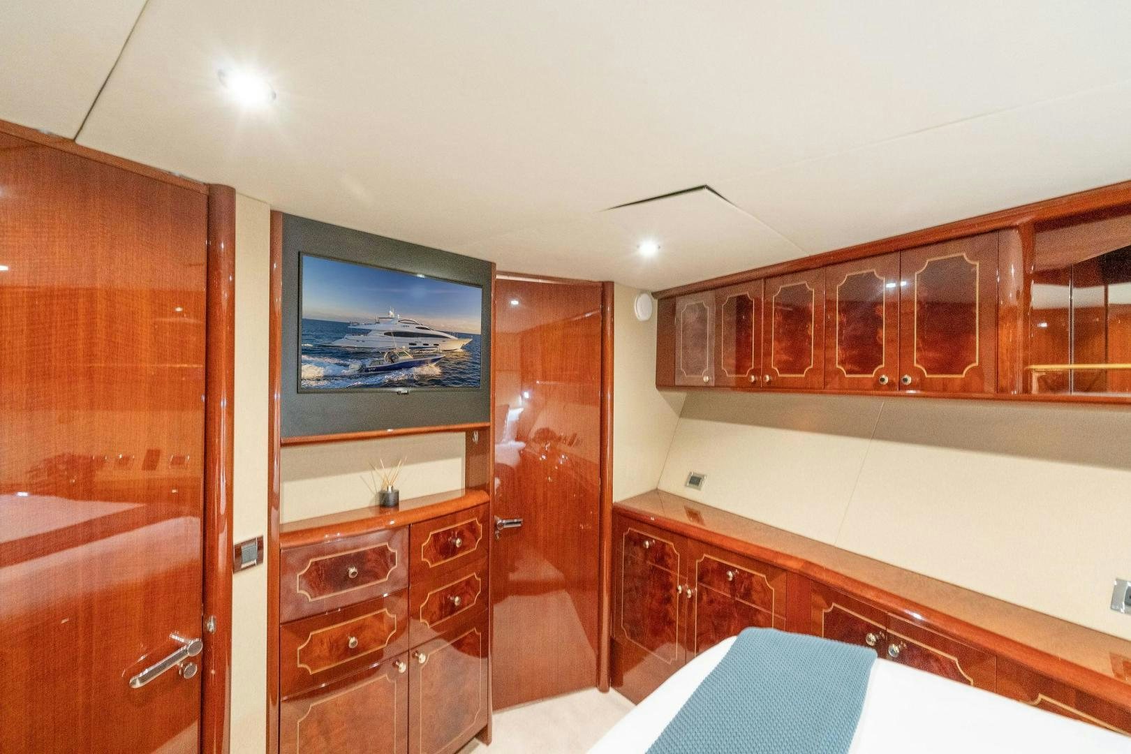 a room with wooden cabinets aboard NAMASTAY Yacht for Sale