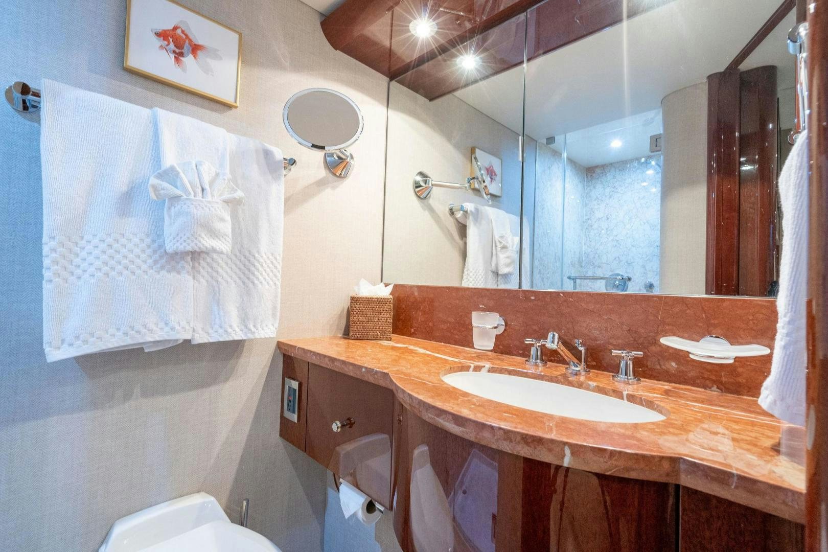 a bathroom with a large mirror aboard NAMASTAY Yacht for Sale