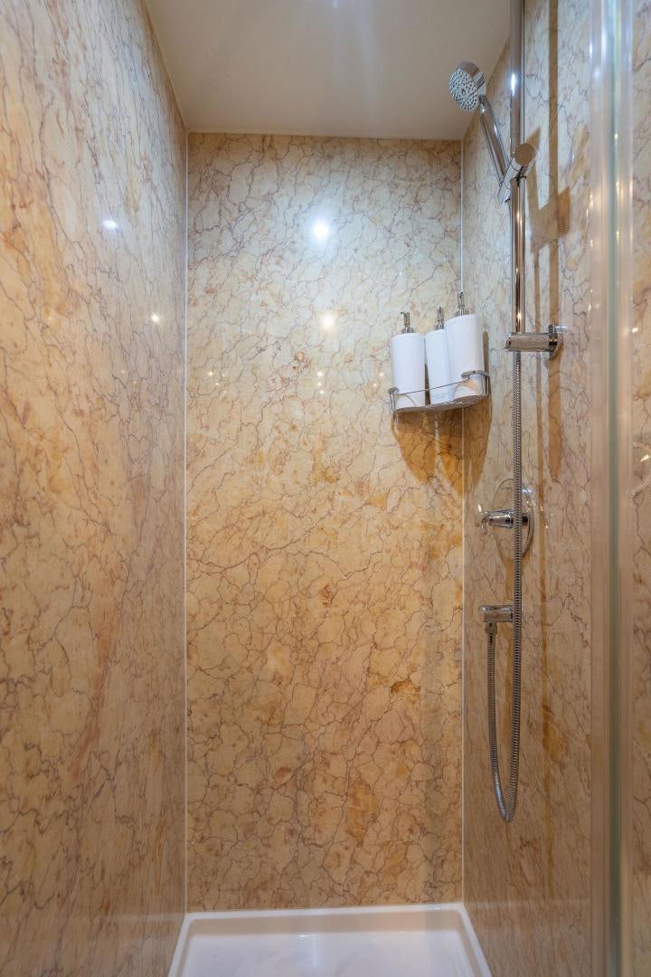 a bathroom with a shower aboard NAMASTAY Yacht for Sale