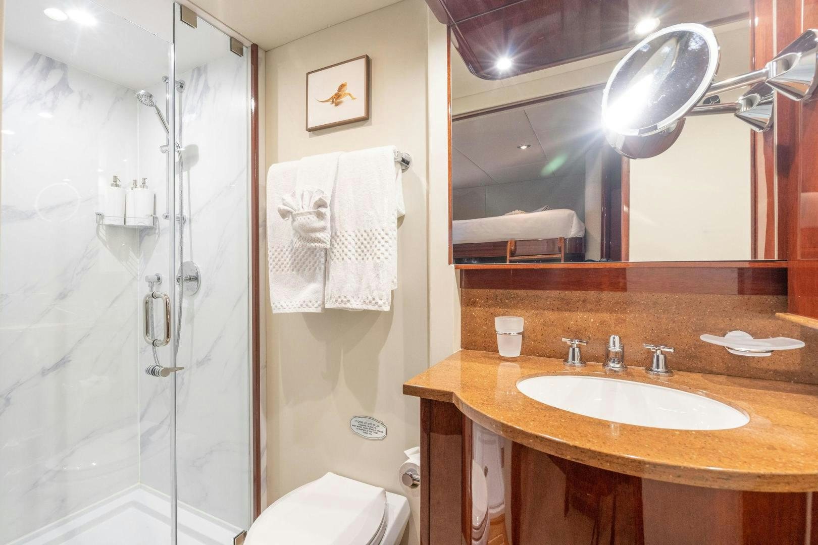 a bathroom with a sink and a mirror aboard NAMASTAY Yacht for Sale