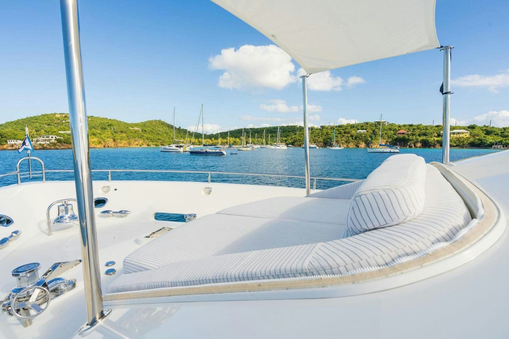 a large white boat in a body of water aboard NAMASTAY Yacht for Sale