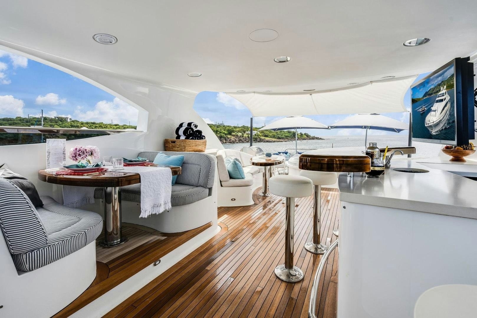 a living room with a large open window aboard NAMASTAY Yacht for Sale