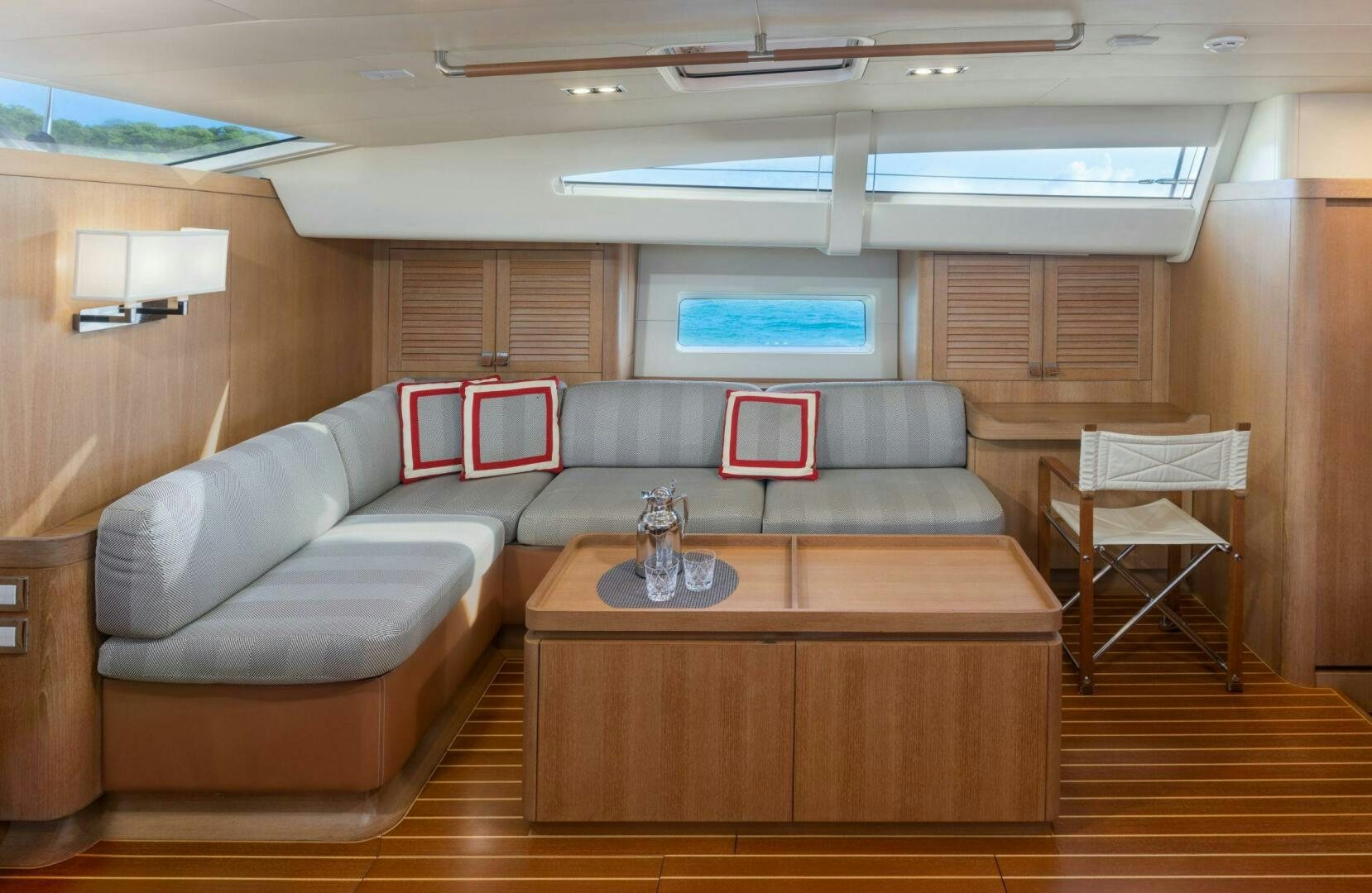 a living room with a couch and a coffee table aboard LEONARA Yacht for Sale