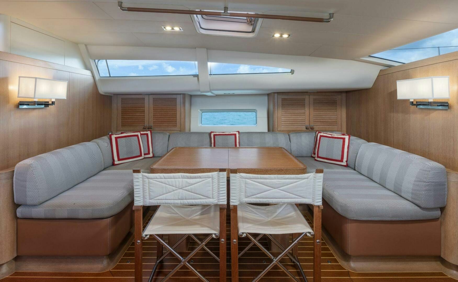a room with a couch and a table and a chair aboard LEONARA Yacht for Sale