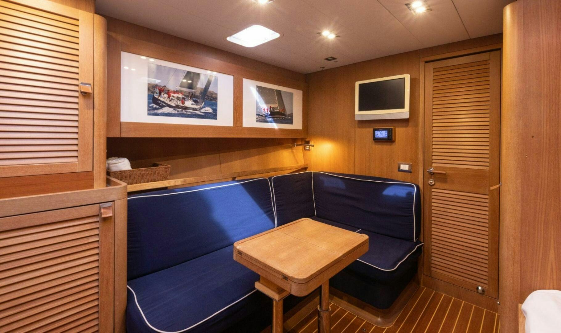 a room with a bed and a desk aboard LEONARA Yacht for Sale