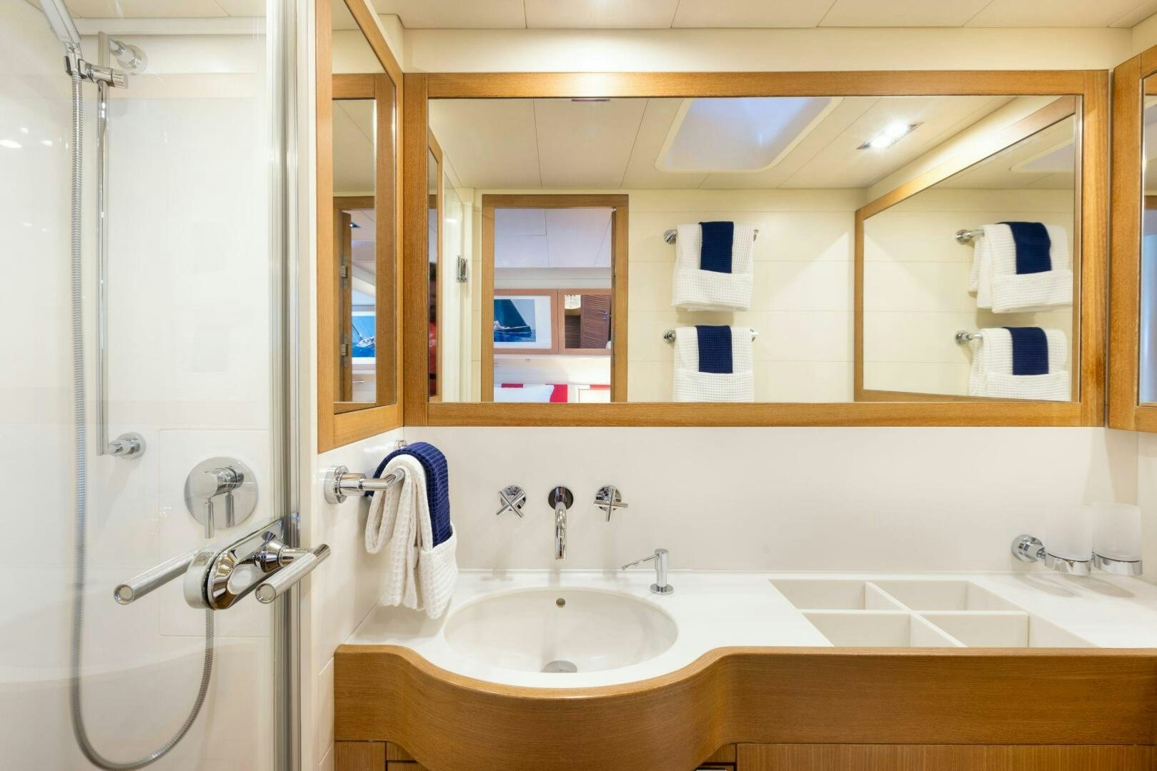 a bathroom with a sink and a mirror aboard LEONARA Yacht for Sale