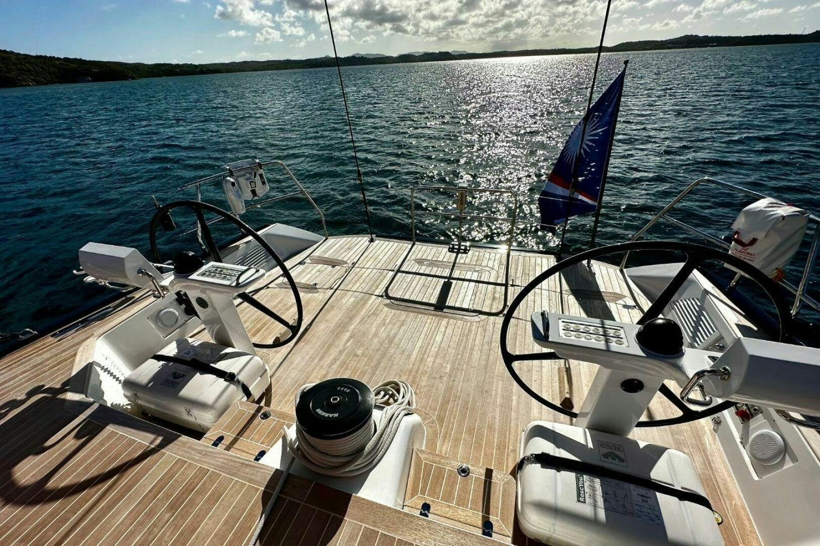 a boat with a flag on the deck aboard LEONARA Yacht for Sale