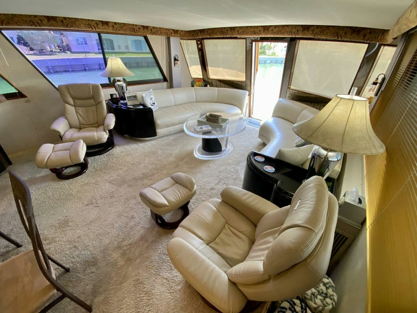 a living room with a large screen aboard CONUNDRUM Yacht for Sale