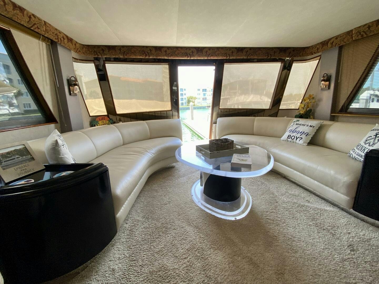 a living room with a couch and a coffee table aboard CONUNDRUM Yacht for Sale