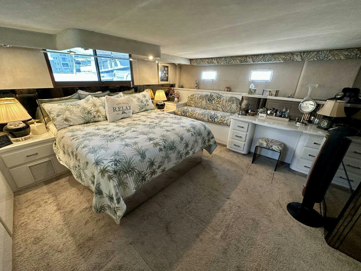 a room with a bed and a desk aboard CONUNDRUM Yacht for Sale