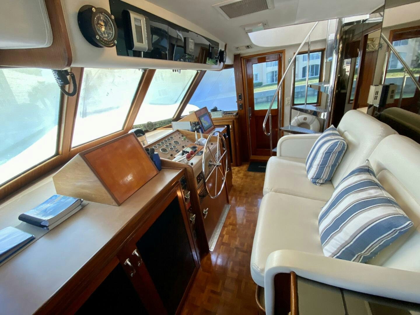 a room with a couch and a table aboard CONUNDRUM Yacht for Sale