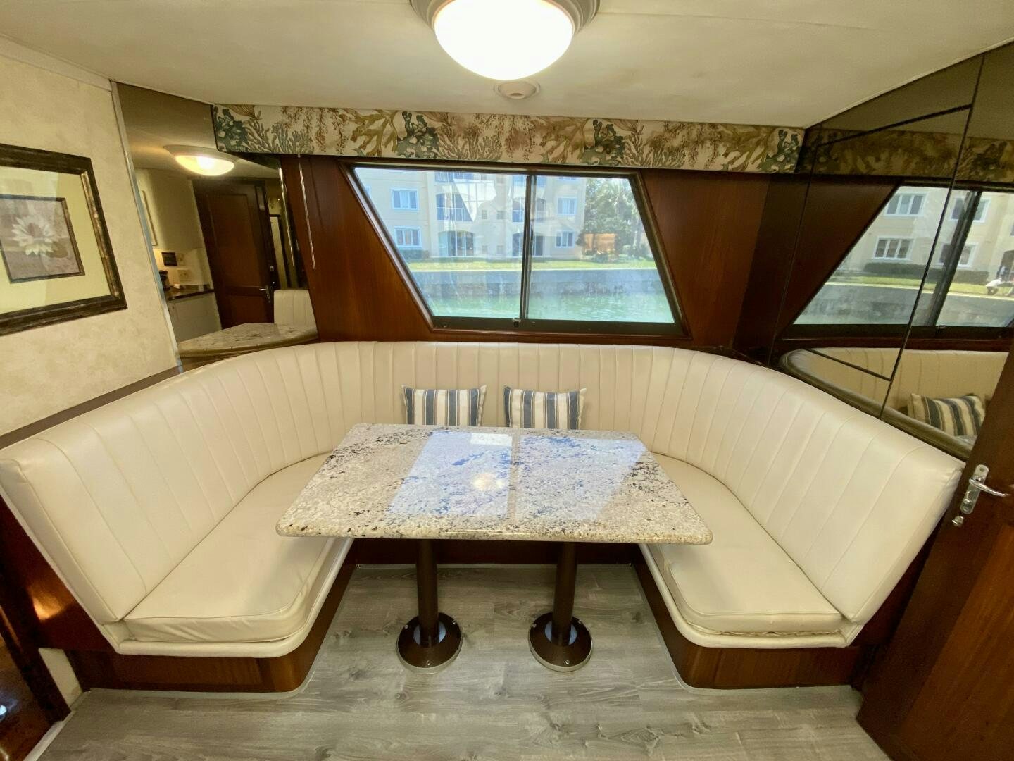 a room with a couch and a table aboard CONUNDRUM Yacht for Sale