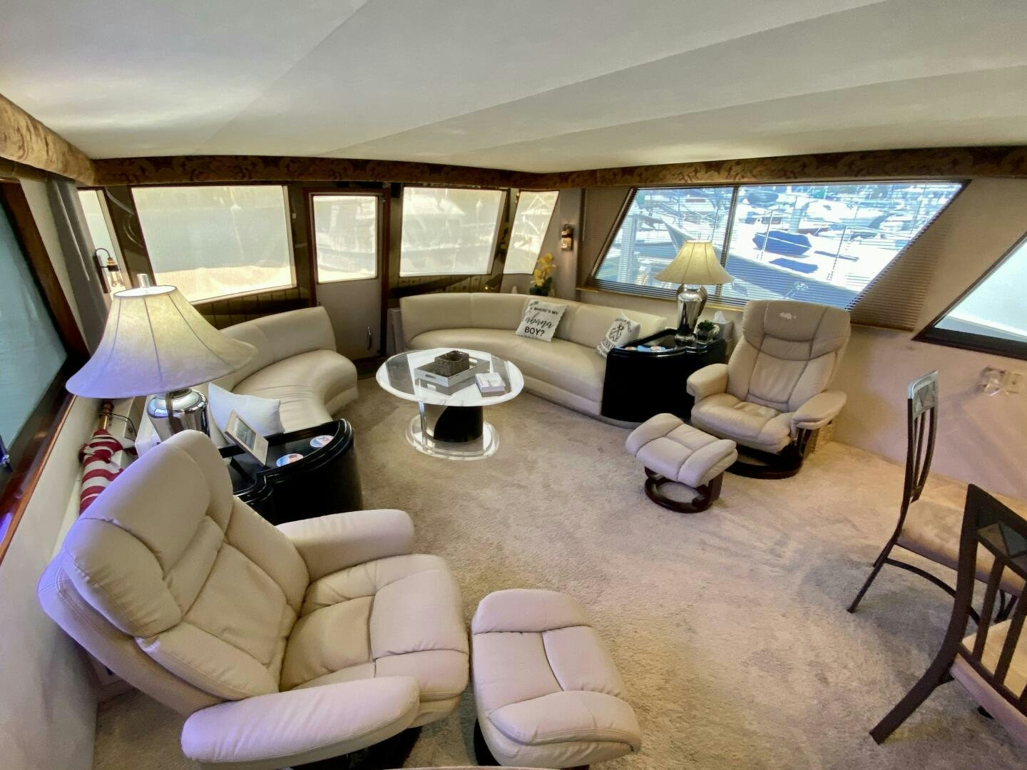 a living room with a large window aboard CONUNDRUM Yacht for Sale