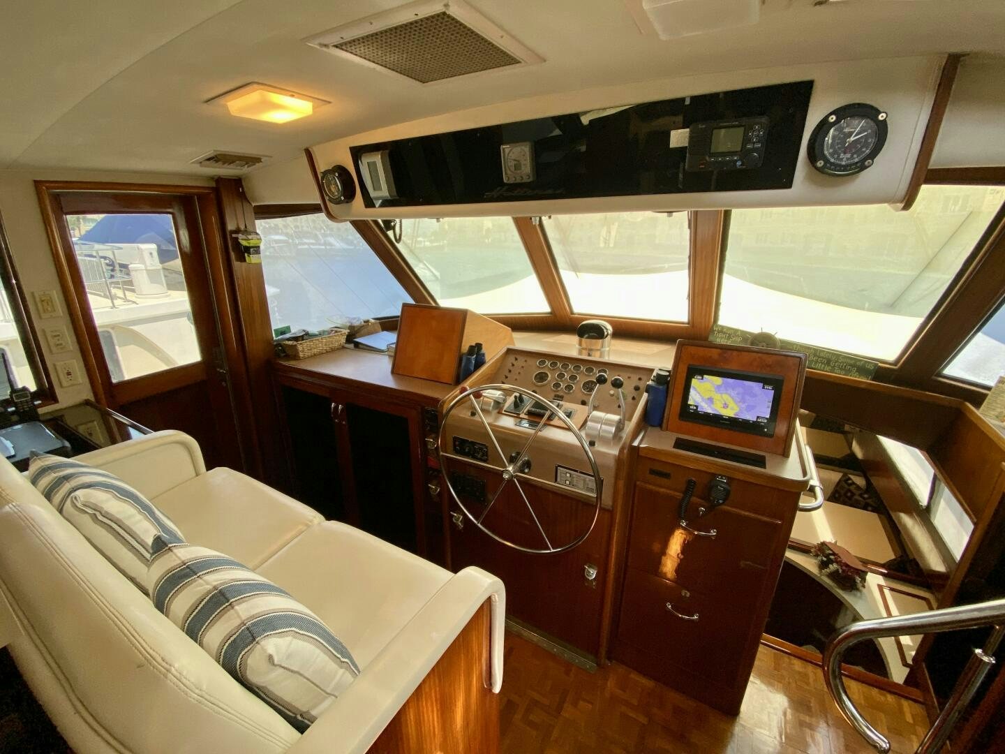 a room with a bed and desk aboard CONUNDRUM Yacht for Sale