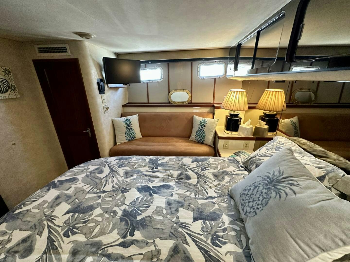 a bed with a couch and a television on it aboard CONUNDRUM Yacht for Sale