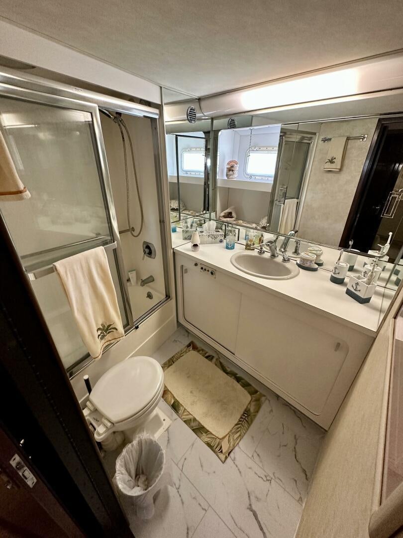 a bathroom with a sink and a toilet aboard CONUNDRUM Yacht for Sale