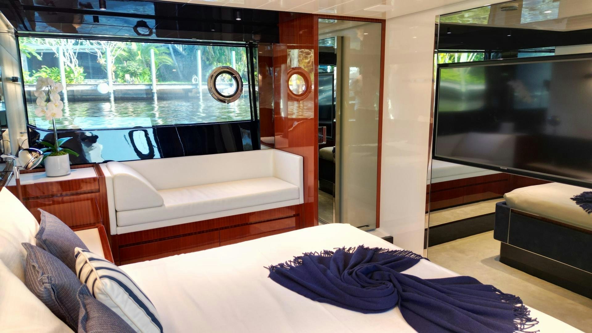 a room with a bed and a tv aboard CAVALLO Yacht for Sale