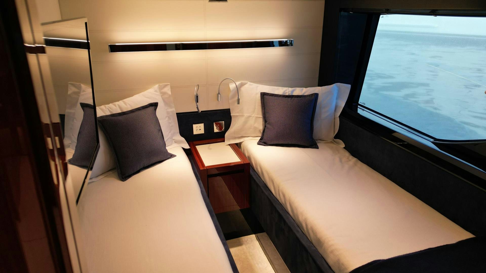 a room with a bed and a window aboard CAVALLO Yacht for Sale