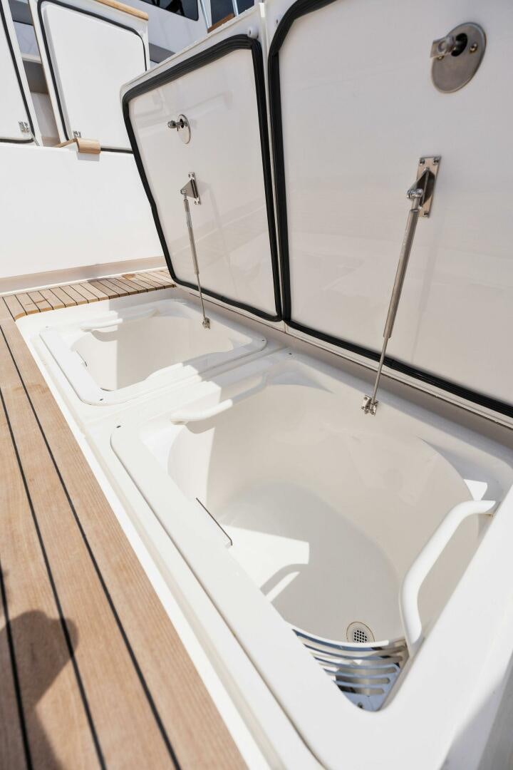 a white bathtub with a hose aboard SHOE  Yacht for Sale
