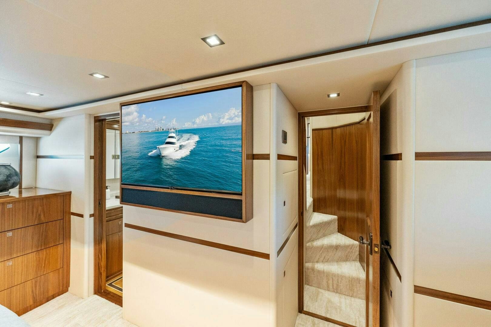 a room with a tv and a door aboard SHOE  Yacht for Sale