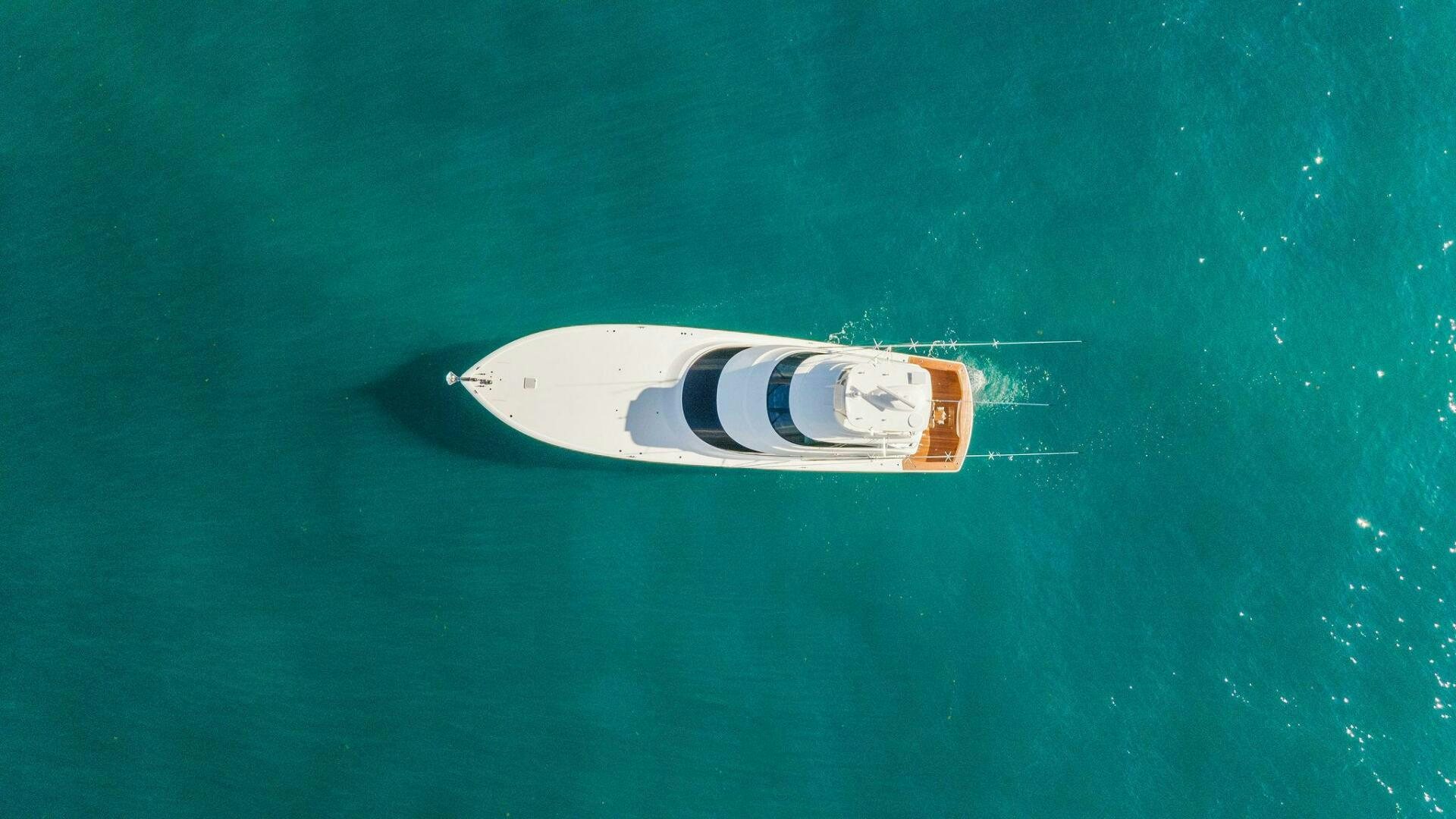 a bottle floating in the water aboard SHOE  Yacht for Sale