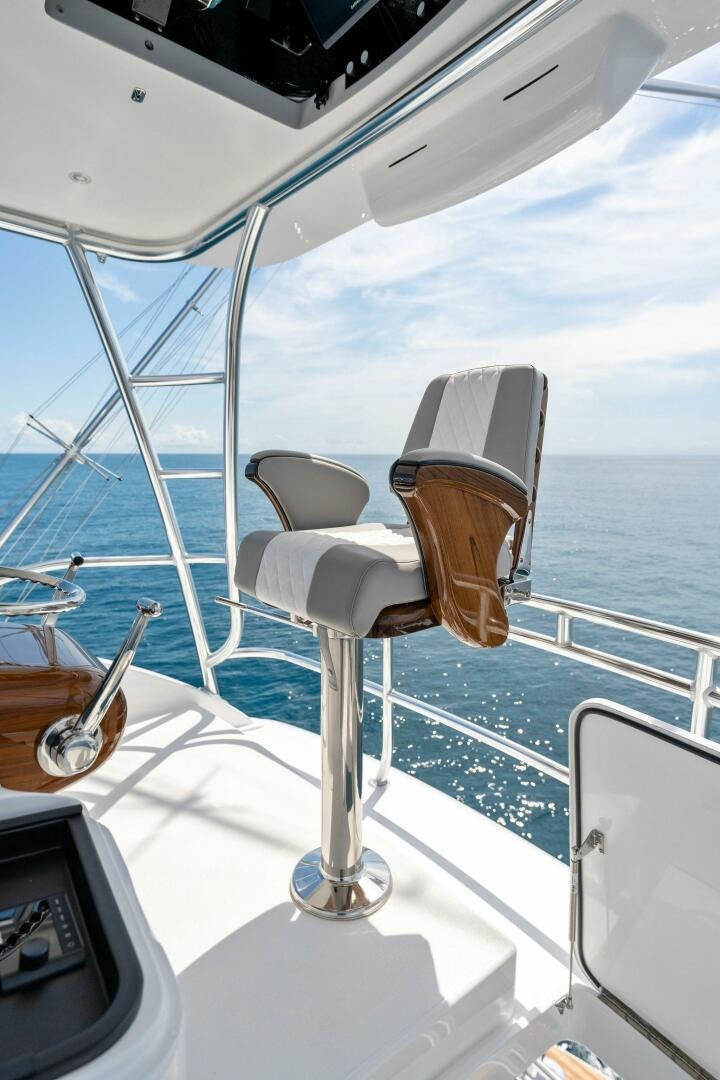 a boat with a chair on the deck aboard SHOE  Yacht for Sale