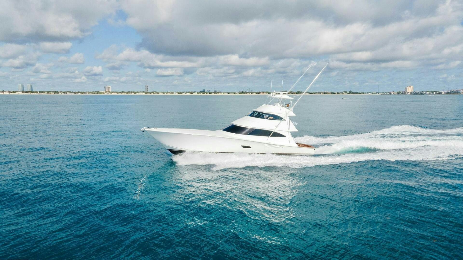 a white boat on the water aboard SHOE  Yacht for Sale
