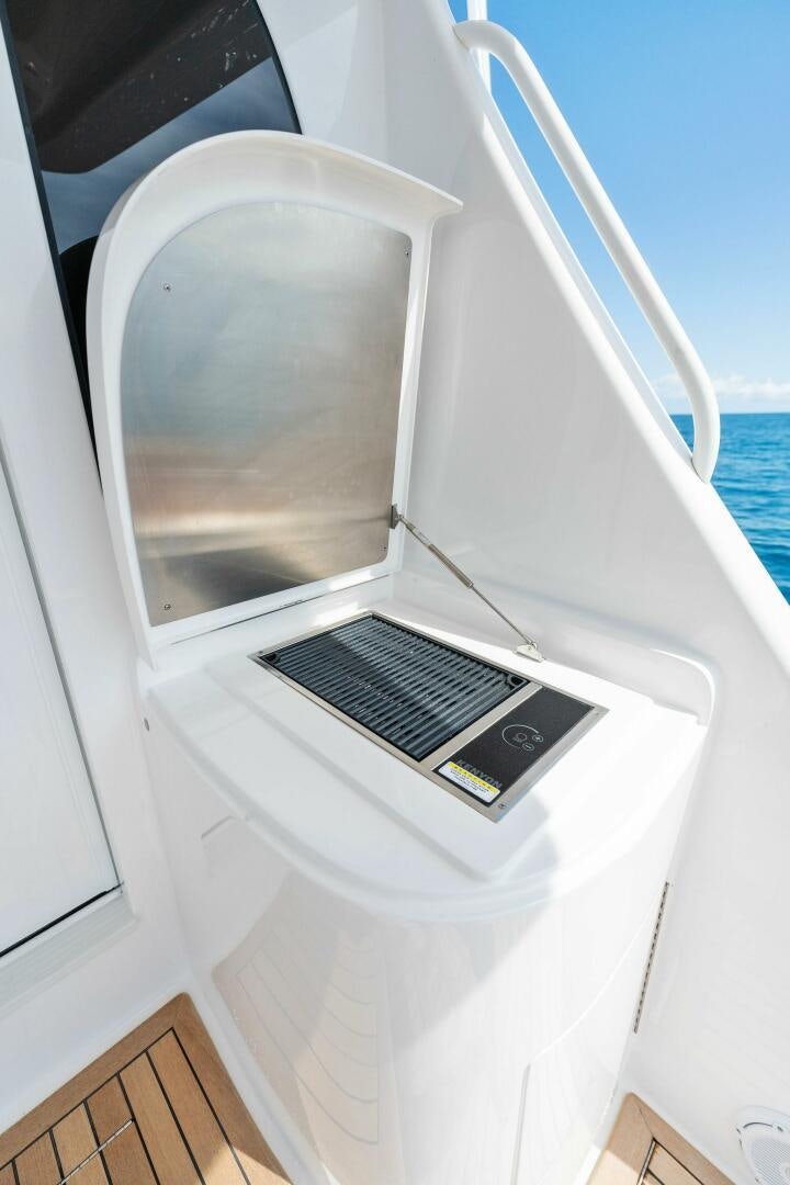 a white machine with a screen aboard SHOE  Yacht for Sale
