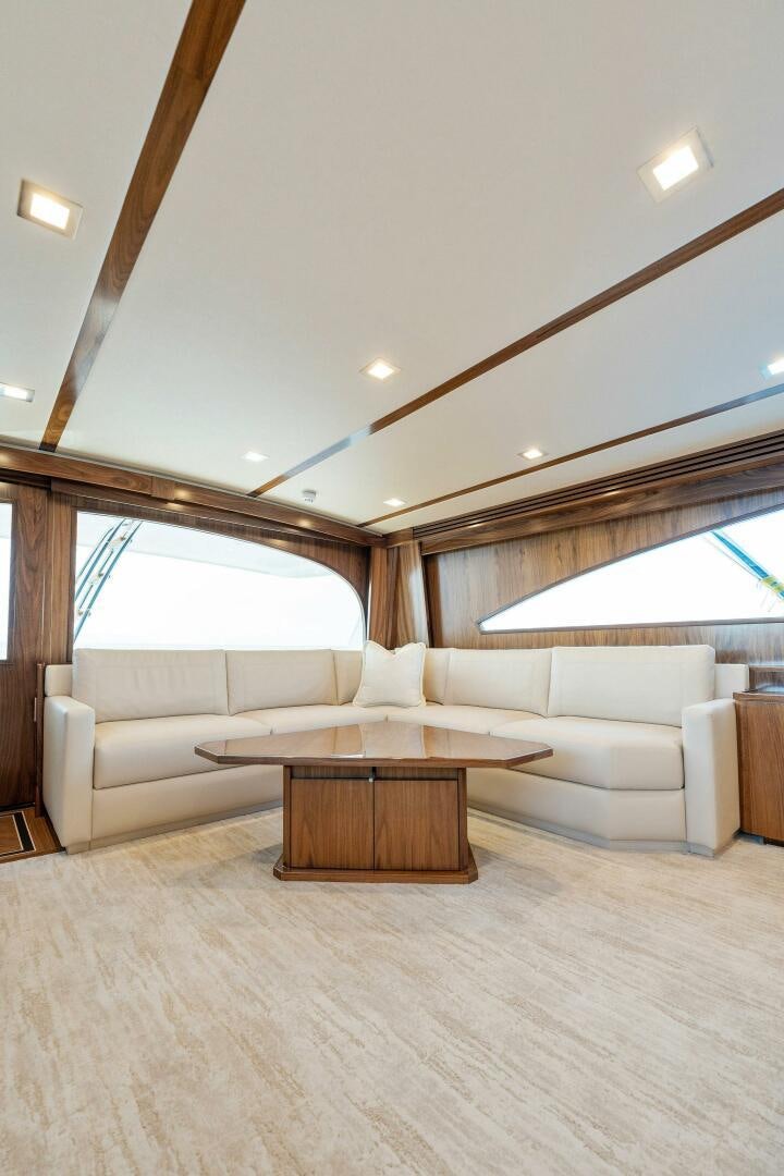 a living room with a couch and a table aboard SHOE  Yacht for Sale