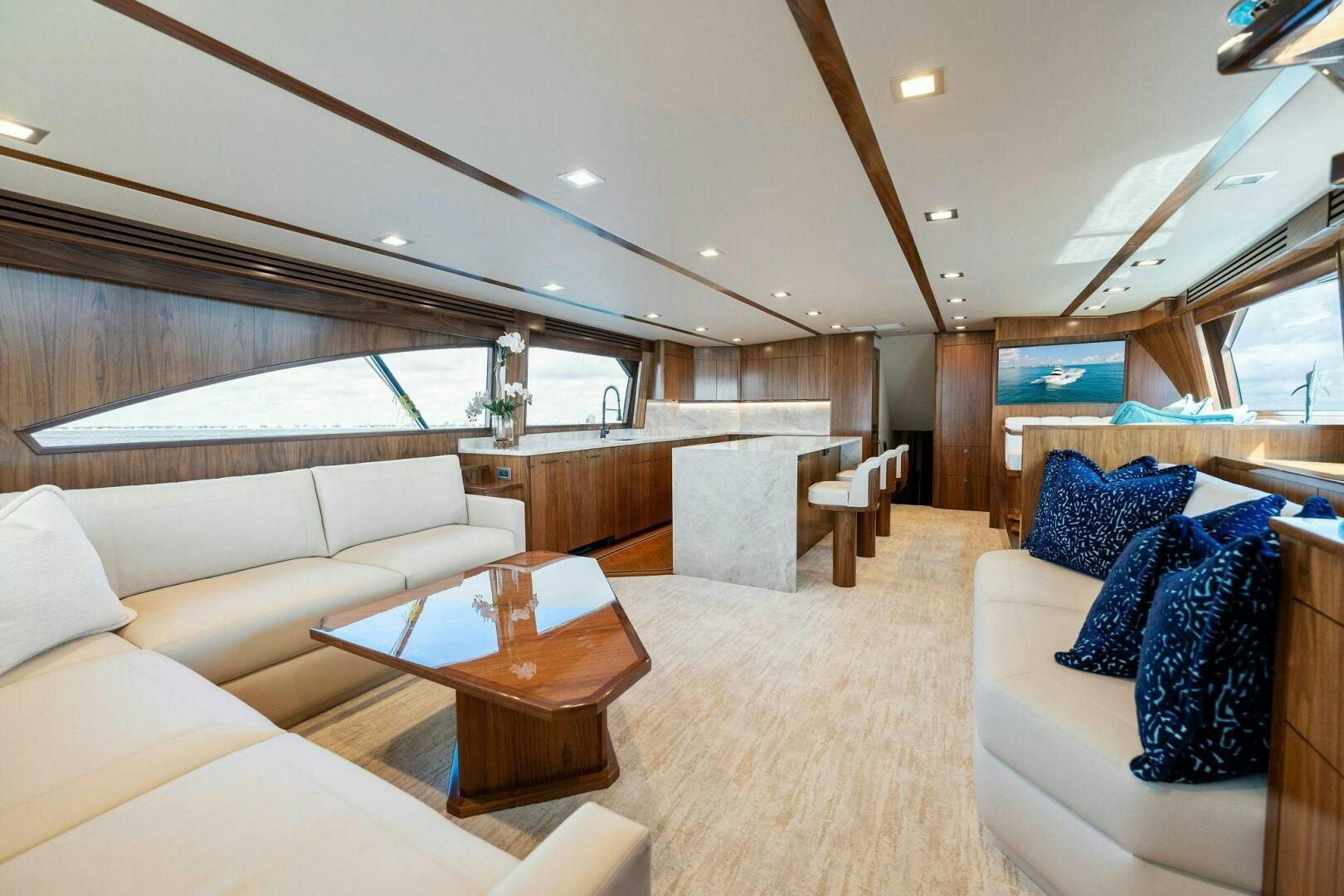 a living room with a couch and a coffee table aboard SHOE  Yacht for Sale