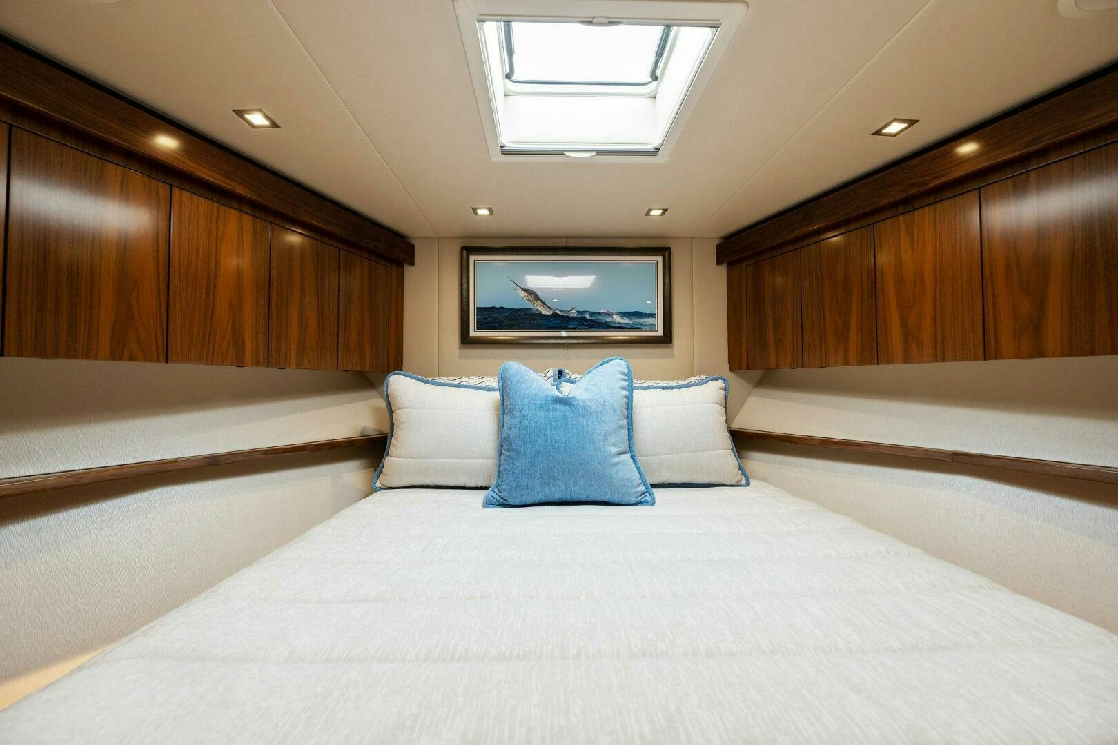 a bed with a white sheet and pillows aboard SHOE  Yacht for Sale