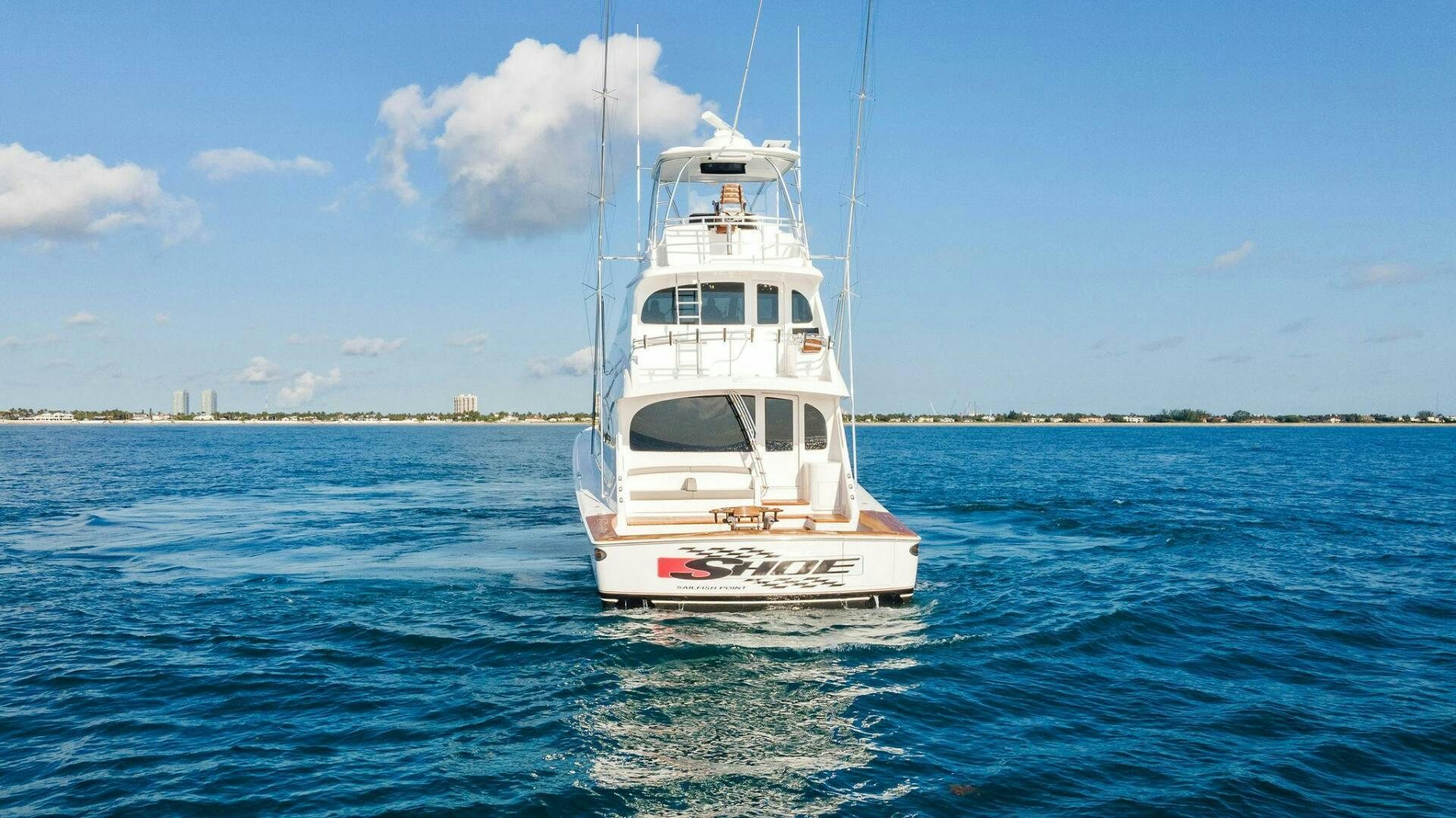 a white boat in the water aboard SHOE  Yacht for Sale