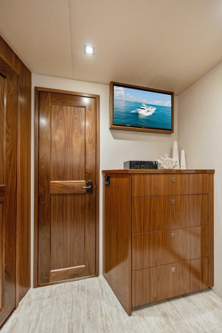 a room with a television and a cabinet aboard SHOE  Yacht for Sale