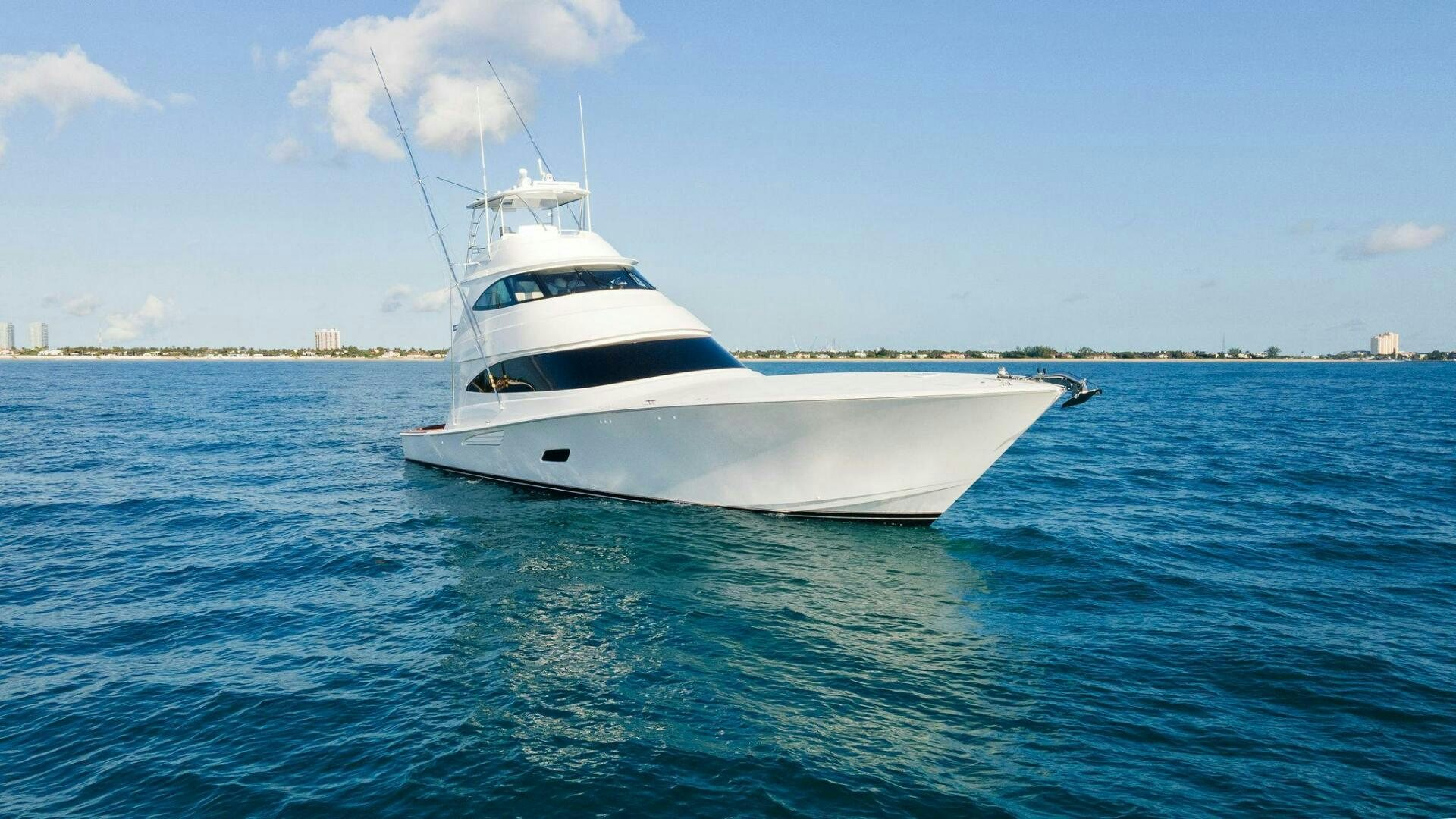 a white boat in the water aboard SHOE  Yacht for Sale